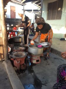 Queen Bahati runs a small cookshop in Dar es Salaam with an assistant. 