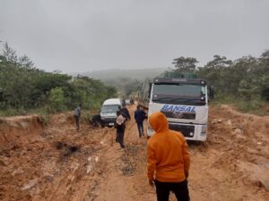 rain-soaked road in the Holo Mountains